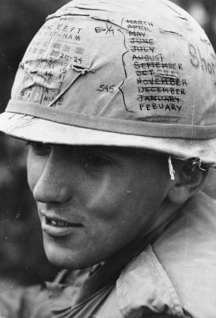 A Sky Trooper from the 1st Cavalry Division (Airmobile) keeps track of the time he has left on his 'short time' helmet..."