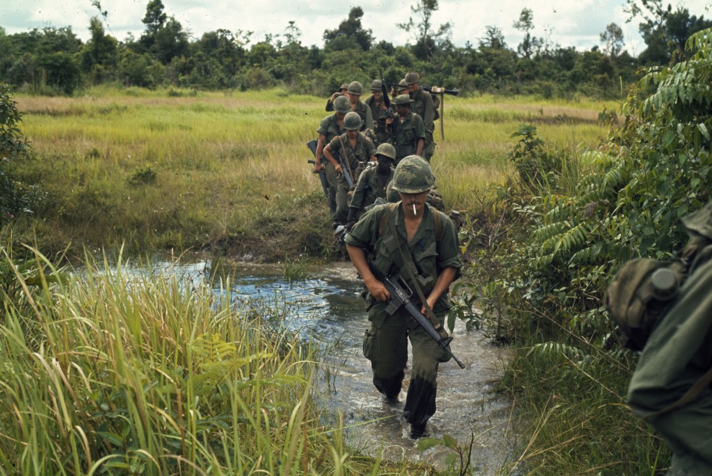 "Vietnam....Members of Company B, 1st Battalion, 27th Infantry Regiment (Wolfhounds), 25th Infantry Division, cross a stream approximately 15 kilometers southeast of Nui Ba Den during search and clear operations near Fire Support Base Kien"