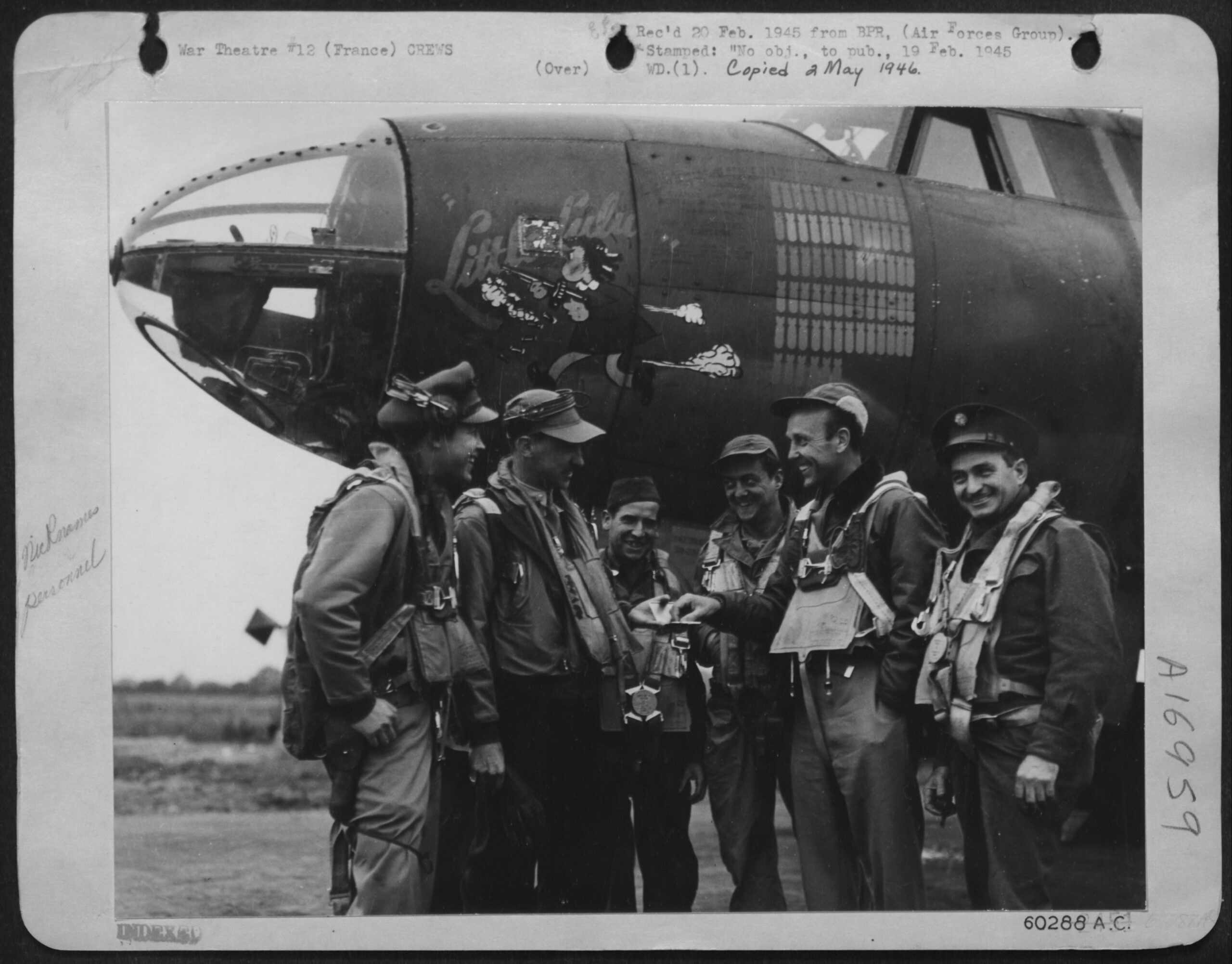 Hearst (5th from left) as a war correspondent – National Archives Identifier: 204891991