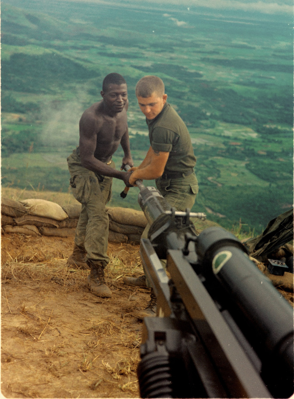 US Soldiers Clearing the Barrel of a 105mm Howitzer, September 17, 1967 – National Archives Identifier: 66956742