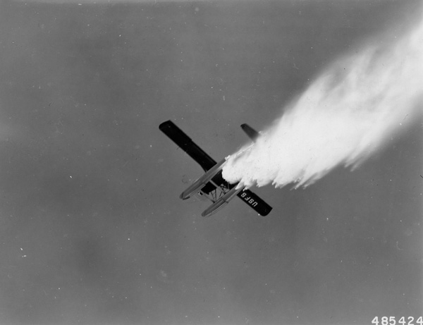 August 1957–a Forest Service Beaver drops water – National Archives Identifier: 2130690